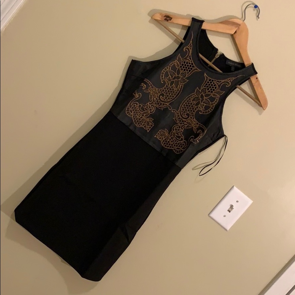 Hold and black dress